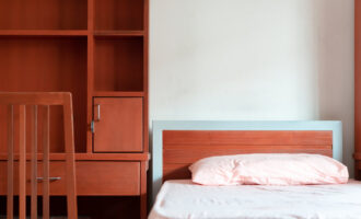 Empty Bedroom of student dormitory in the university, clean interior hostel